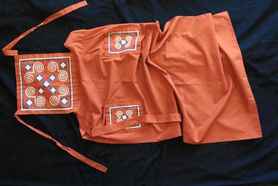 E1432: Hmong Clothing, Reverse Applique Burnt Orange Color Apron Snail Motif