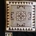 E1429: Hmong Pillow, Reverse Applique Brown and White, Snail and Star Motif.