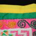 E1460: Hmong small reverse applique with embroidery house motif chain-link snail motif and quarter step motif. 