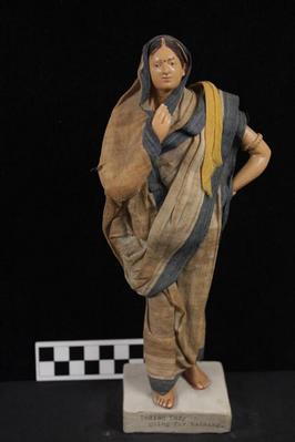 E1300: India- Clay Figurine, "Indian Lady Going for Bathing"