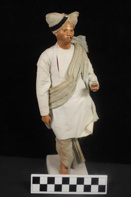 E1269: India- Clay Figurine, "Indian Bearer"