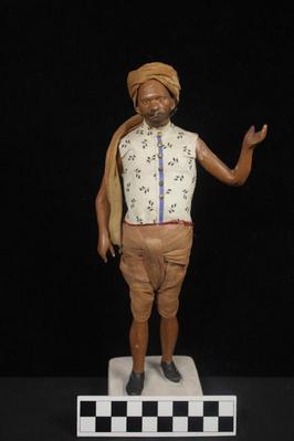 E1296: India- Clay Figurine, Bearer