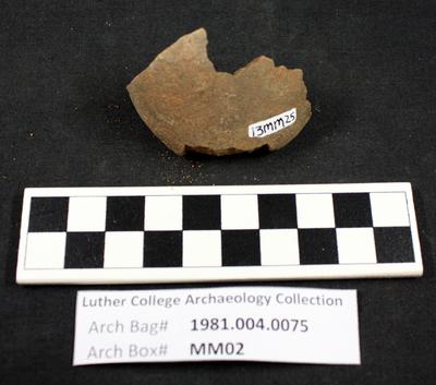 1981.004.0075; ground stone - hammerstone- fragment
