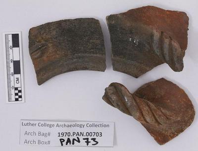 1970.PAN.00703: Decorated rim sherds with handle fragments
