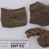 1970.PAN.00703: Decorated rim sherds with handle fragments
